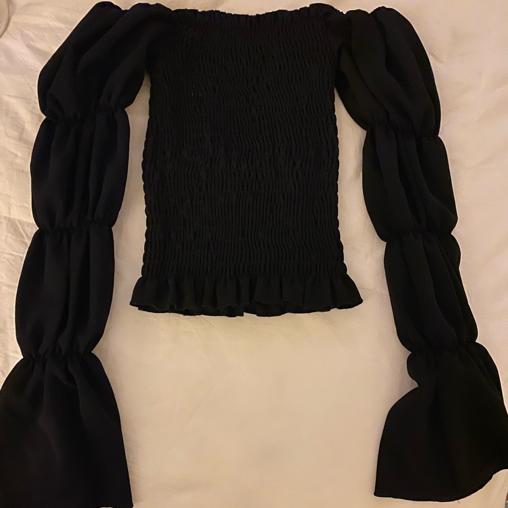 Ribbed material could be worn off the shoulder or not black shirt